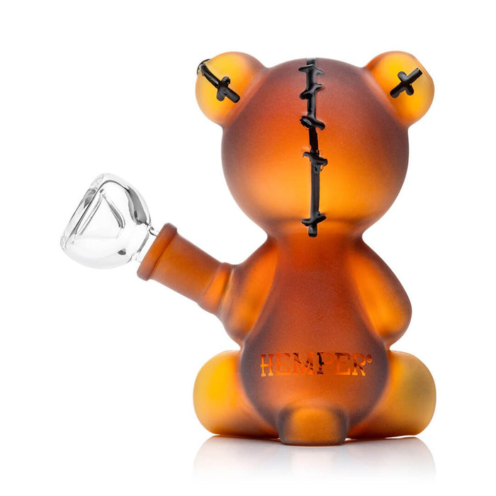Amber-colored bear-shaped bong with a bowl on a white background