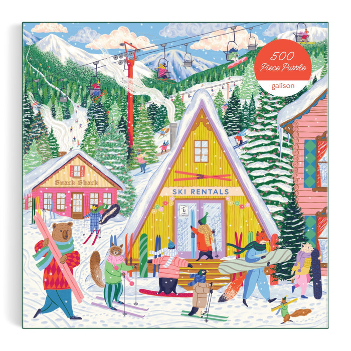 The Emily Taylor Ski Village 500 Piece Puzzle features a colorful ski resort scene with animal characters skiing, snowboarding, and renting gear at a yellow lodge, snowy mountains and a ski lift in back, and a Snack Shack on the left.