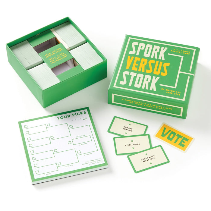 The Brass Monkey Spork Versus Stork Social Game includes cards, a “Your Picks” score pad, and a yellow “VOTE” card—perfect for fun with friends and all arranged on a white background.