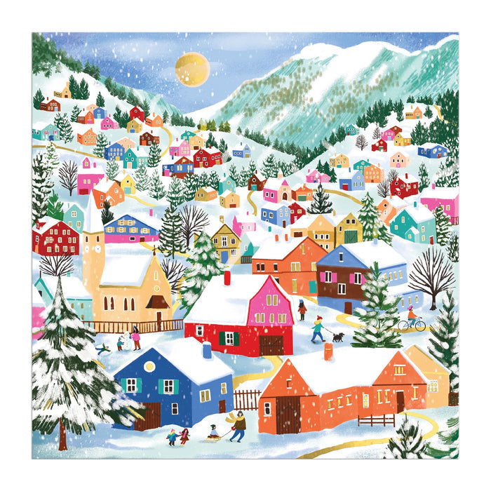 Experience the Swiss Alpine Village 500 Piece Foil Puzzle by Joanna Clay, featuring a vibrant snowy village with colorful houses, people skiing and playing, snow-laden trees, and mountains beneath a partly cloudy sky.