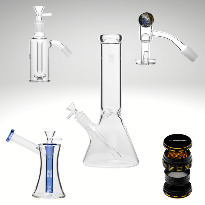 Collection of glass smoking apparatuses on a white background