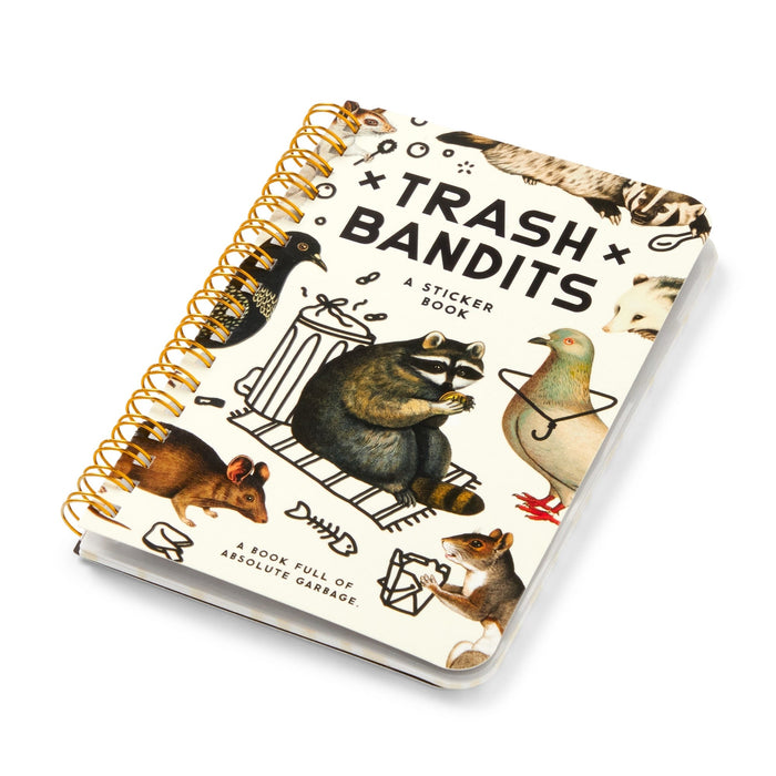 The Brass Monkey Trash Bandits Sticker Book is spiral-bound and features puffy stickers of illustrated animals (raccoon, pigeon, rat, squirrel, skunk) around a trash can. The cover reads: "A book full of absolute garbage.