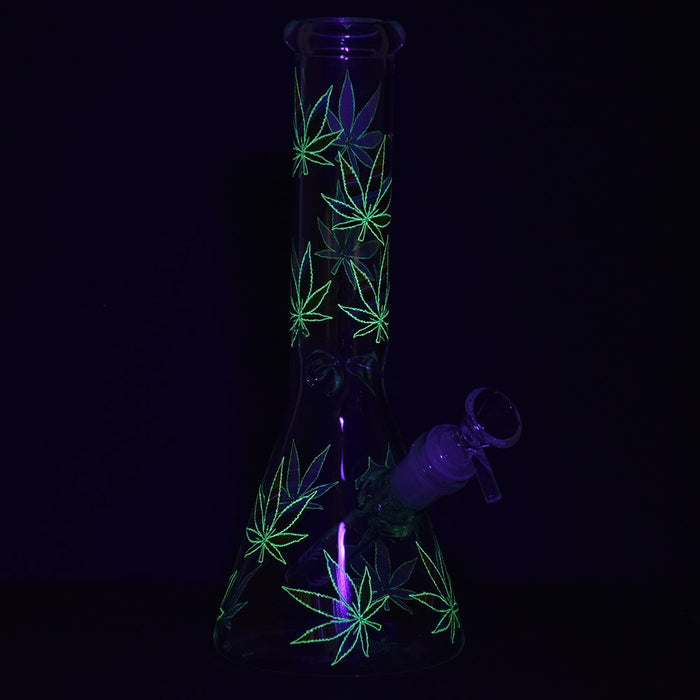 Glow I’m the dark hemp leaf acccents on glass bong in the dark