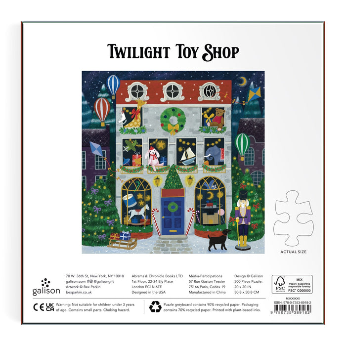 Enjoy the magical "Twilight Toy Shop 500 Piece Foil Puzzle" by Bex Parkin, featuring a festive night scene with animals, toys, wreaths, Christmas lights, floating hot air balloons, and falling snow in vibrant detail.