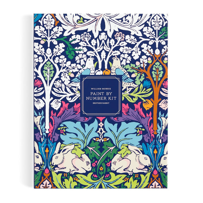 An ornate cover displays a vibrant floral pattern with two white rabbits and blue birds. Centered is the title: “William Morris Brother Rabbit 9 x 12" Paint by Number Kit” by William Morris.