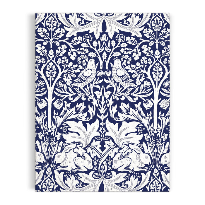 The William Morris Brother Rabbit 9 x 12" Paint by Number Kit features a vintage white-on-blue pattern with two birds on branches and two rabbits among ornate leaves and flowers. Brand: William Morris.