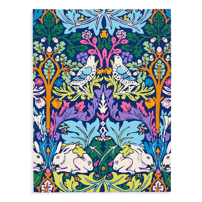The William Morris Brother Rabbit 9 x 12" Paint by Number Kit features a vibrant floral pattern with two blue and white birds, colorful leaves and flowers, and two white rabbits. Bold blues, purples, oranges, and greens stand out in this symmetrical design.