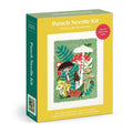 The Anja Riebensahm Woodland Mushrooms Punch Needle Kit comes in a yellow and green box featuring a vibrant mushroom and plant design. Included are canvas, punch needle, threader, yarn, and instructions.