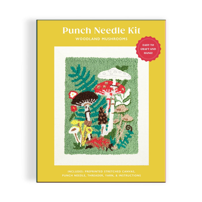The Anja Riebensahm Woodland Mushrooms Punch Needle Kit features a colorful mushroom and plant design on the box and includes a canvas, punch needle, threads, yarn, and instructions.