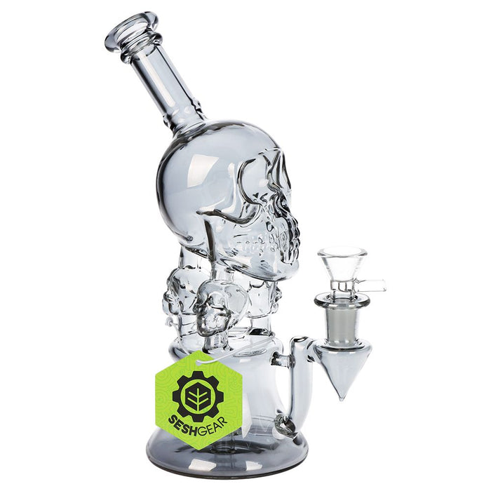 Glass skull-shaped water pipe with a Sesh Gear label on a white background